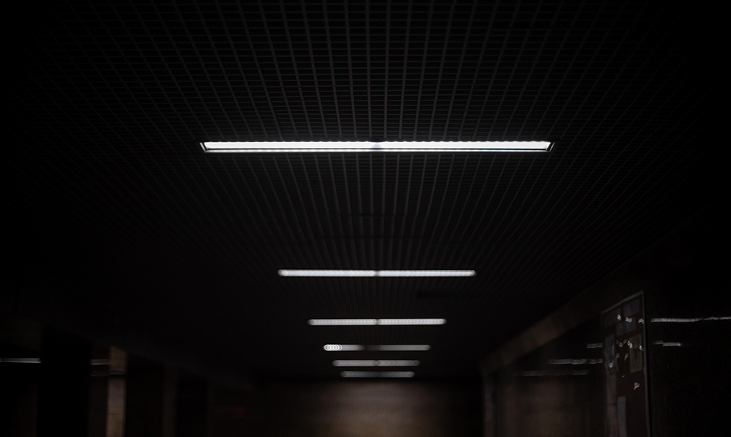 Lamps along the tunnel. Underground passage at night in the city.