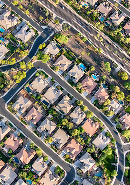 Aerial view looking directly down on homes in a planned exclusive residential community in the Scottsdale area of Arizona.