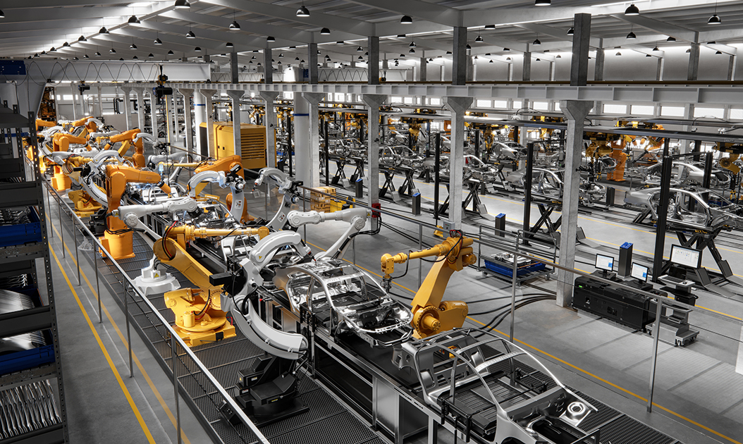 High angle view of cars on production line in factory. Many robottic arms doing welding on car metal body in manufacturing plant. Image in 3D render