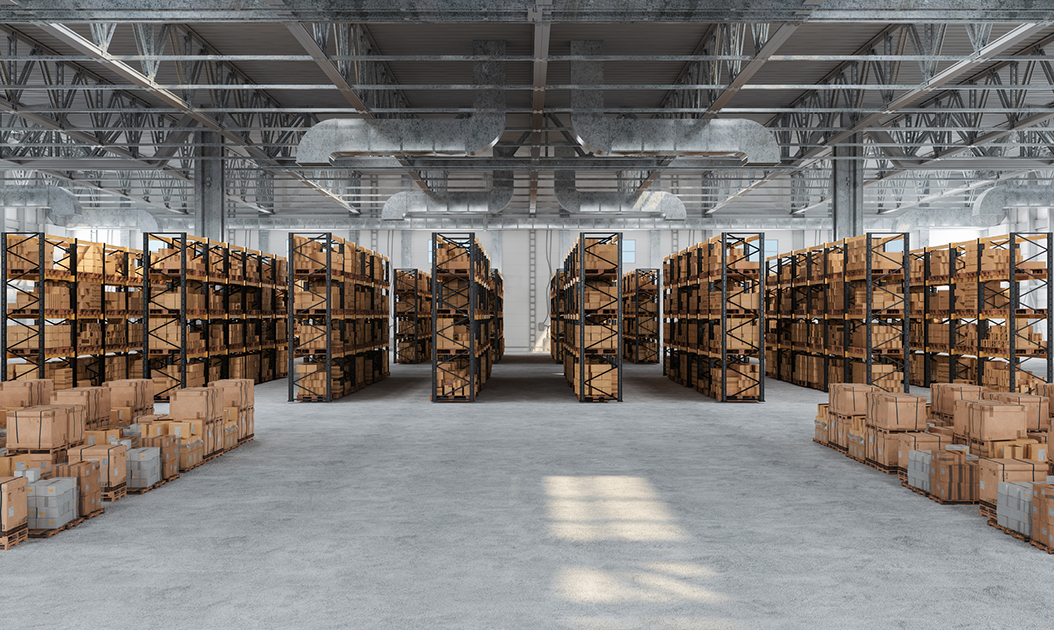 Distribution Warehouse With Cardboard Boxes On The Racks And On The Floor